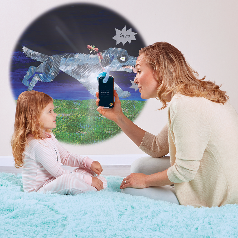 Mother reading to daughter with the Moonlite Storytime Projector