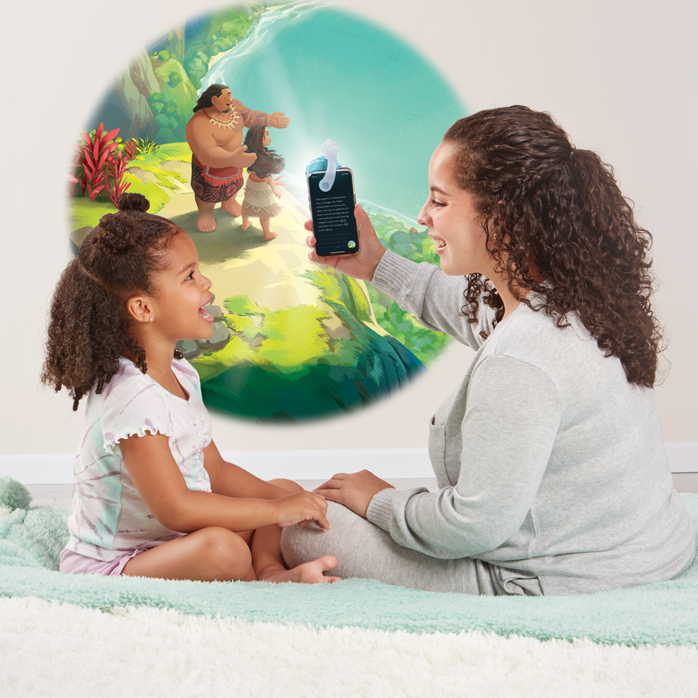 Mother and daughter reading Disney Princess stories using the Moonlite Storytime Projector.