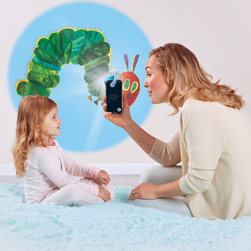 Mom and daughter reading Eric Carle stories with Moonlite Storytime.