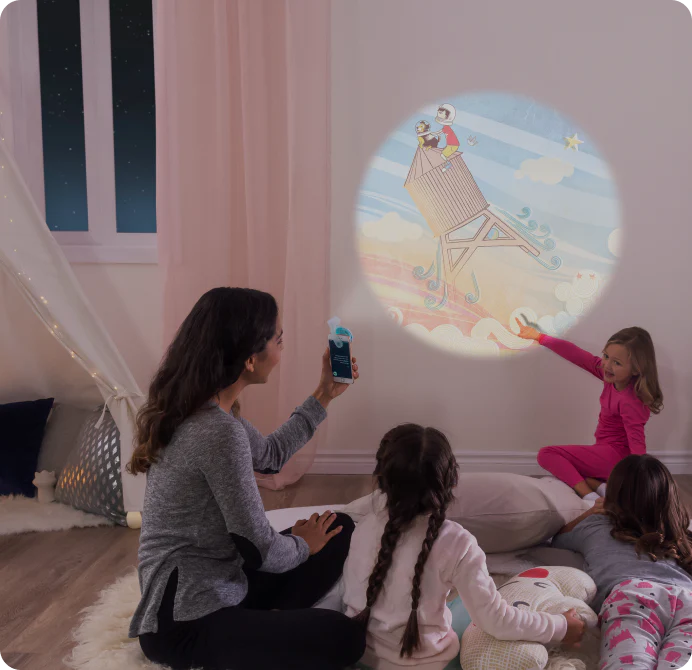 Mom and 3 Daughters having fun with their My Moonlite Story Book Projector